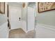 Entryway with neutral walls, white trim, tile floors, and coat hooks at 4221 Hibiscus Dr. # 8-203, Little River, SC 29566