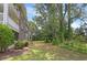 Exterior view of a building with trees and green grass in a community at 4221 Hibiscus Dr. # 8-203, Little River, SC 29566