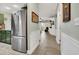 Hallway view leading to living room and showcasing stainless steel refrigerator at 4221 Hibiscus Dr. # 8-203, Little River, SC 29566