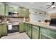 Well-equipped kitchen with stainless steel appliances and custom cabinets at 4221 Hibiscus Dr. # 8-203, Little River, SC 29566