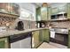 Updated kitchen sink with a view, stainless steel appliances, and custom cabinets at 4221 Hibiscus Dr. # 8-203, Little River, SC 29566