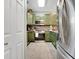 Open kitchen layout featuring stainless steel appliances and custom cabinetry at 4221 Hibiscus Dr. # 8-203, Little River, SC 29566