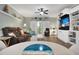 Inviting living room with coastal decor, ceiling fan, and access to the balcony at 4221 Hibiscus Dr. # 8-203, Little River, SC 29566