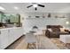 Relaxed living area with tile flooring, green cabinets, neutral walls, and comfortable furniture at 4221 Hibiscus Dr. # 8-203, Little River, SC 29566