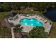 Aerial view of the community swimming pool with seating and landscaped areas at 4221 Hibiscus Dr. # 8-203, Little River, SC 29566