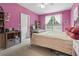 Bright bedroom with pink walls, carpet, a ceiling fan and a window with blinds and curtains at 4691 Mill Pond Rd., Murrells Inlet, SC 29576