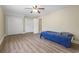 Bedroom features a ceiling fan, wood-look flooring, and two closets at 4691 Mill Pond Rd., Murrells Inlet, SC 29576