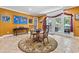 Dining room with a glass table, decorative map, tile floors, and view to French doors that lead outside at 4691 Mill Pond Rd., Murrells Inlet, SC 29576