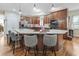 Spacious kitchen island with granite counters and wooden cabinets, perfect for gathering and entertaining at 4691 Mill Pond Rd., Murrells Inlet, SC 29576