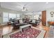 Cozy living room featuring hardwood floors, comfortable seating, and an open layout connected to the kitchen area at 4691 Mill Pond Rd., Murrells Inlet, SC 29576