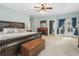 Elegant main bedroom featuring a large bed, dresser, and private access to the outdoors at 4691 Mill Pond Rd., Murrells Inlet, SC 29576
