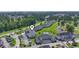 Beautiful aerial view showcases lush landscaping, a pool, nearby waterway, and verdant golf course views at 4827 Orchid Way # 1-203, Myrtle Beach, SC 29577