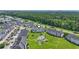 Aerial view of condos surrounded by a golf course, showcasing the pool and beautiful landscape at 4827 Orchid Way # 1-203, Myrtle Beach, SC 29577