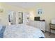 Comfortable bedroom is well-lit and has a dresser with a television on top at 4827 Orchid Way # 1-203, Myrtle Beach, SC 29577