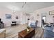 Open-concept living space with neutral tones, seamlessly connecting the living and dining areas at 4827 Orchid Way # 1-203, Myrtle Beach, SC 29577