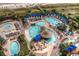 Aerial view of a resort featuring multiple pools, lounge chairs, and beautifully landscaped areas at 4986 Salt Creek Ct., North Myrtle Beach, SC 29582