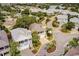 Stunning aerial view of a home featuring a two-car garage, palm trees, and a metal roof at 4986 Salt Creek Ct., North Myrtle Beach, SC 29582