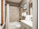 Cozy bathroom with shower-tub combination, ceramic tile and elegant decorative accents at 4986 Salt Creek Ct., North Myrtle Beach, SC 29582