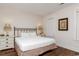 Bedroom featuring bed, nightstands, lamps, and wood flooring at 4986 Salt Creek Ct., North Myrtle Beach, SC 29582