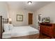 Comfortable bedroom with a cozy bed, a dresser, and a window with blinds at 4986 Salt Creek Ct., North Myrtle Beach, SC 29582
