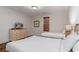 Comfortable bedroom with two twin beds, dresser and a mounted television at 4986 Salt Creek Ct., North Myrtle Beach, SC 29582