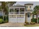 Charming two-story home with a two-car garage, front porch and lush landscaping at 4986 Salt Creek Ct., North Myrtle Beach, SC 29582