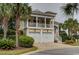 Inviting two-story home with a well-manicured lawn and attractive architectural details at 4986 Salt Creek Ct., North Myrtle Beach, SC 29582