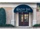 Exterior shot of a spa featuring an elegant entrance and professional signage at 4986 Salt Creek Ct., North Myrtle Beach, SC 29582