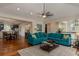Open-concept living room with hardwood floors connects to the dining area and kitchen at 4986 Salt Creek Ct., North Myrtle Beach, SC 29582