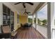 Inviting covered porch with dining table and seating, ideal for outdoor entertaining at 4986 Salt Creek Ct., North Myrtle Beach, SC 29582