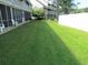 Lush green backyard with well-maintained lawn and partial fencing, offering ample outdoor space at 500 Fairway Village Dr. # 4-F, Myrtle Beach, SC 29588