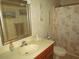 Bathroom features a vanity with integrated sink, toilet and shower with beach themed accents at 500 Fairway Village Dr. # 4-F, Myrtle Beach, SC 29588