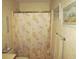 Bathroom with shower showcasing patterned shower curtain, vanity and towel racks at 500 Fairway Village Dr. # 4-F, Myrtle Beach, SC 29588