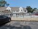 Exterior view of a condo community pool with a parking lot in front of the buildings at 500 Fairway Village Dr. # 4-F, Myrtle Beach, SC 29588