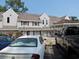 Multi-Gathering residence with parking, showcasing the exterior of the building with a well-maintained facade at 500 Fairway Village Dr. # 4-F, Myrtle Beach, SC 29588