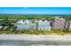 Expansive aerial view capturing the oceanfront location of a multi-building complex and crowded beach at 5300 N Ocean Blvd. # 442, Myrtle Beach, SC 29577