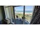 Relaxing balcony featuring chairs, a table, and panoramic beach views for serene outdoor enjoyment at 5300 N Ocean Blvd. # 442, Myrtle Beach, SC 29577