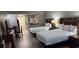 Clean and serene bedroom with two beds, wooden accents, and neutral tones at 5300 N Ocean Blvd. # 442, Myrtle Beach, SC 29577