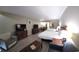 Bright open living room with two beds, a dresser, and seating at 5300 N Ocean Blvd. # 442, Myrtle Beach, SC 29577