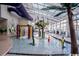 Indoor waterpark with playful features including slides, sprinklers, and tropical accents for Gathering entertainment at 5300 N Ocean Blvd. # 442, Myrtle Beach, SC 29577