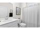 Clean, modern bathroom with white vanity, toilet, and shower with curtain at 534 Calhoun Falls Dr., Myrtle Beach, SC 29579