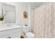 This bathroom features a white toilet and sink with a patterned shower curtain at 534 Calhoun Falls Dr., Myrtle Beach, SC 29579