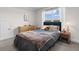 Bedroom with a large window and a comfortable bed with grey and brown covers at 534 Calhoun Falls Dr., Myrtle Beach, SC 29579