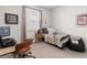 Bedroom with carpet and a comfortable bed with grey and patterned covers and a desk at 534 Calhoun Falls Dr., Myrtle Beach, SC 29579