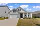 Charming single-Gathering home with a well-manicured lawn, welcoming front porch, and attached two-car garage at 534 Calhoun Falls Dr., Myrtle Beach, SC 29579