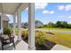 Inviting front porch with classic columns and bench, landscaped for curb appeal at 534 Calhoun Falls Dr., Myrtle Beach, SC 29579