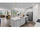 Open-concept kitchen with stainless steel appliances, a central island, and seamless flow to the dining and living areas at 534 Calhoun Falls Dr., Myrtle Beach, SC 29579
