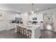 Spacious kitchen featuring a large island with barstool seating, stainless steel appliances, and pendant lighting at 534 Calhoun Falls Dr., Myrtle Beach, SC 29579