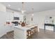 Bright, open kitchen features a large island with seating, white cabinetry, and modern pendant lighting at 534 Calhoun Falls Dr., Myrtle Beach, SC 29579