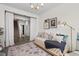 Casual living room with daybed, stylish rug, and inviting decor leading to the stairway at 534 Calhoun Falls Dr., Myrtle Beach, SC 29579